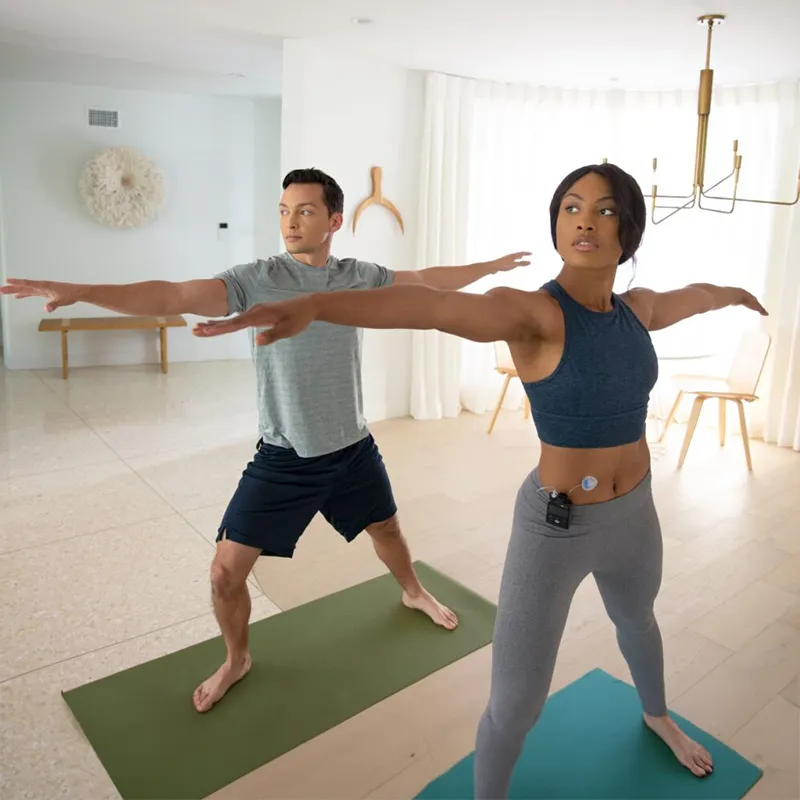 Two people doing yoga